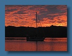 10 Hokulea and the sunset in Viani Bay